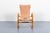 Lounge armchair by Gustaf Axel Berg for Bröderna Andersson, Sweden. 1940s. The chair has a curved beech frame with the...
