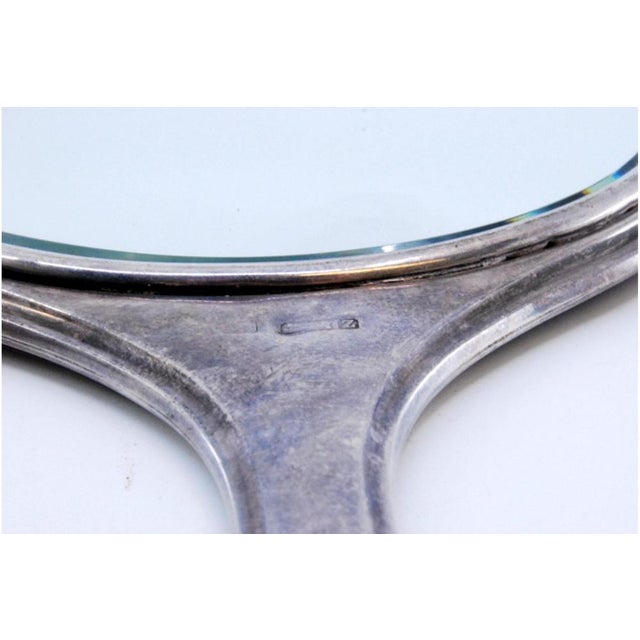 Round Hand Mirror in Plain Silver with Sunbeams Behind It, in Very Good conditions. Designed 1920 to 1949 This piece has...