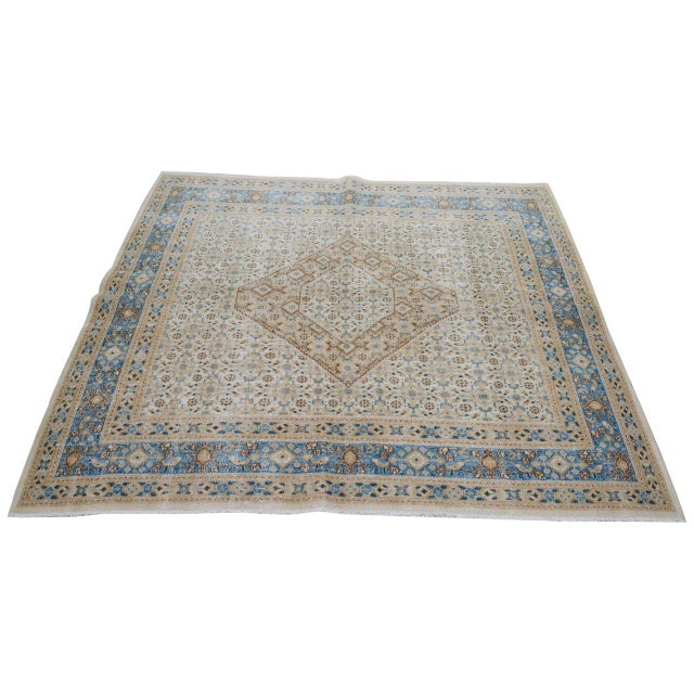 Hand-knotted with care using traditional rug-making techniques, this wool rug blends timeless craftsmanship with a modern...