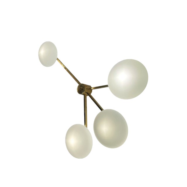 This lamp features four asymmetrical arms in gilded brass and Murano glass shades, hand-blown by Venetian masters on the...