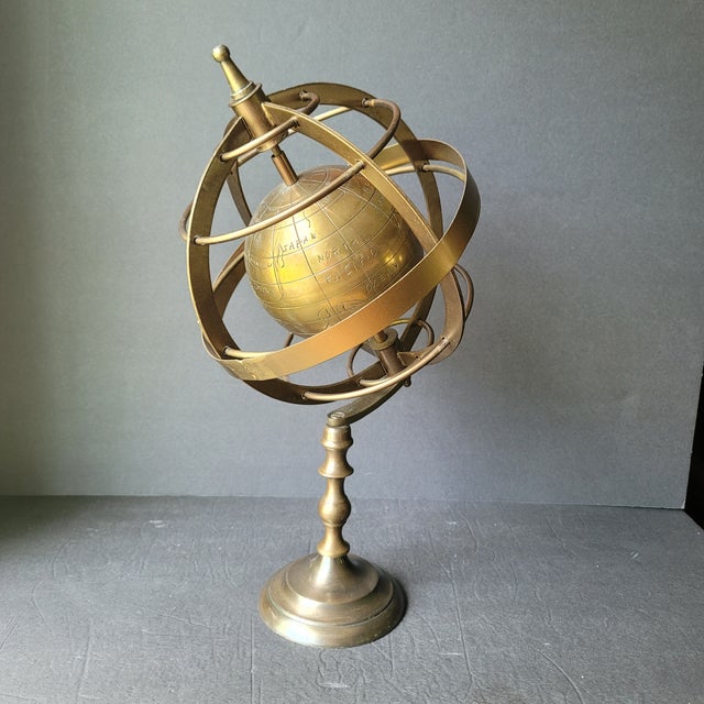 Brass Gold Metal Globe on Tall Stand Measures approx 16" tall x 9" diameter Etched brass globe that spins in stand Some...