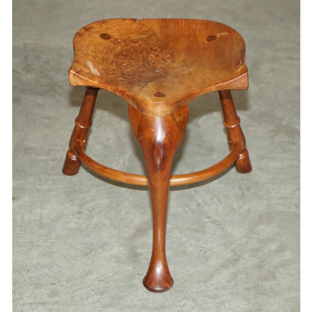 We are delighted to offer for sale this stunning burr yew wood vintage three legged stool with exquisite patina top. A...