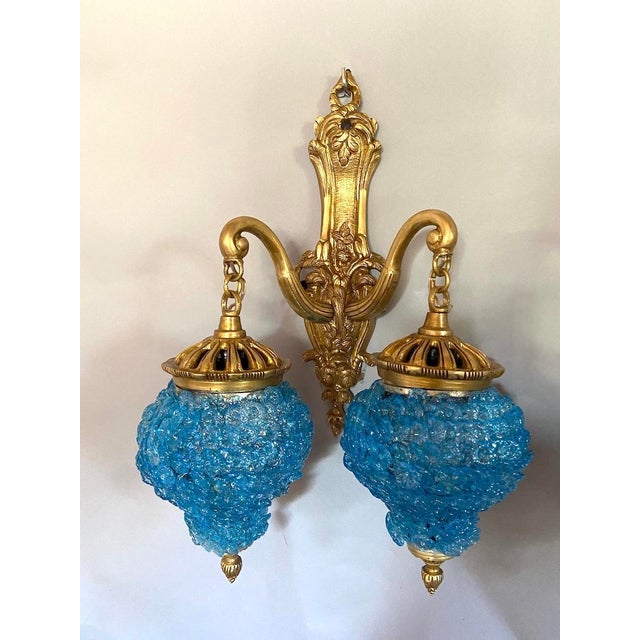 A beautiful pair of French wall sconces, crafted circa 1980 in an elegant Louis XVI Revival style. These decorative...