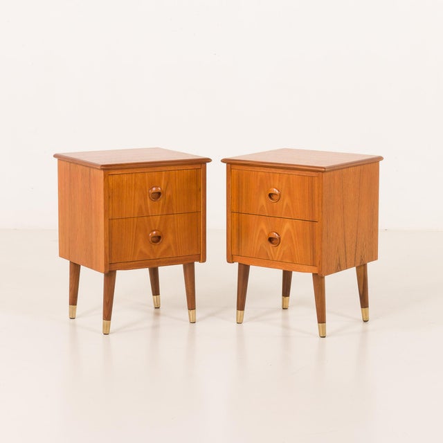 This charming pair of Danish nightstands from the 1950s is a fine example of mid-century craftsmanship, embodying the...