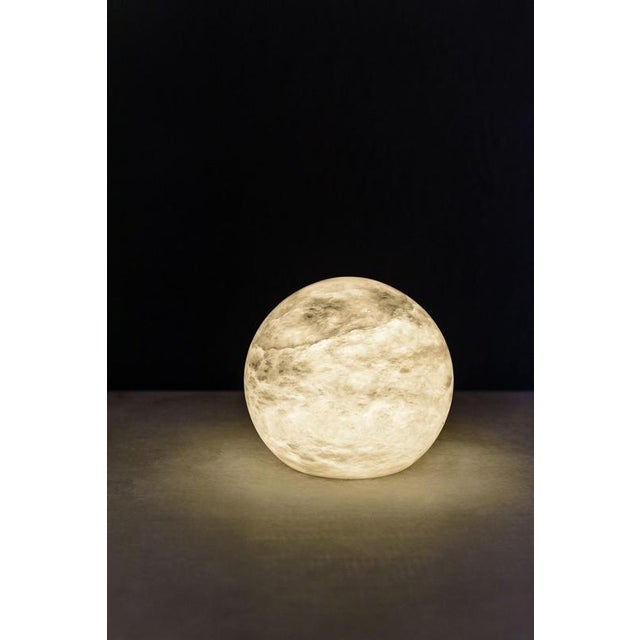 Wireless Moon Small Table Lamp by United Alabaster Dimensions: ⌀ 18 cm (Customizable Height) Materials: Alabaster, Copper...