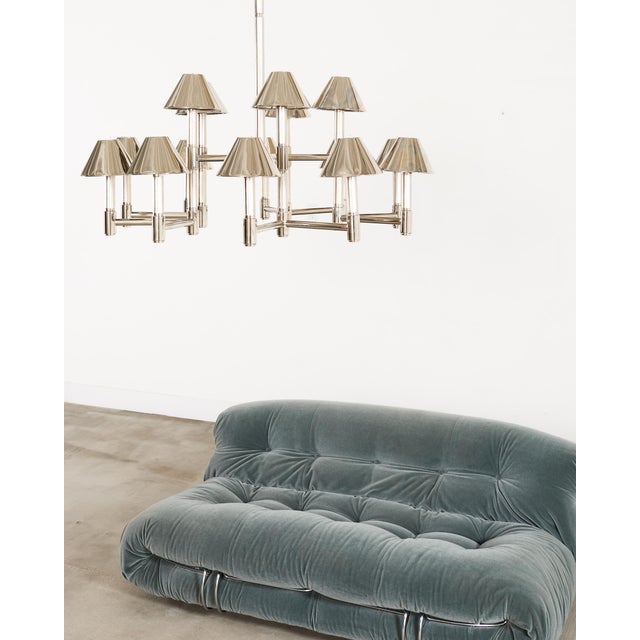 A striking Ralph Lauren Home "Barrett Large Knurled 15-light Chandelier" constructed out of solid brass with an opulent...