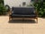 Mid-century-style sofa. The sofa was made in the style of Ib Kofod-Larsen. The sofa is stained a light walnut, matte...