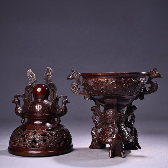 This is an impressive vintage Chinese bronze censer, featuring a highly detailed pierced lid and a tripod stand. The body...