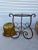 Handmade Brown wrought Iron stand measuring 15” x 17.5” tall. Includes a large air blown glass . The glass bowl that sits...