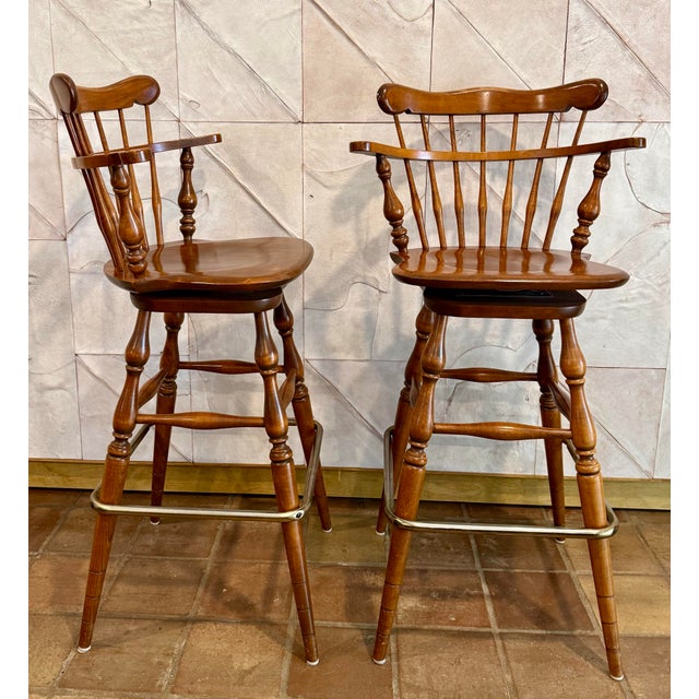 Mid-Century Modern Vintage Ethan Allen Heirloom Nutmeg Maple Colonial Early American Pub Style Swivel Barstool With Metal Footrest- A Pair For Sale - Image 3 of 12