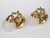 Spectacular Pair of 1950s Spanish Empire Style Hand-Chased Brass 1-Light Wall Sconces. Outfitted with original matching...