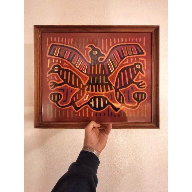 Artisanal fabric called Kuna Mola framed. Made by the women of the San Blas Islands aka Kuna Yala off the coast of Panama.