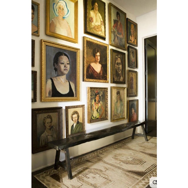 A captivating Mid Century oil portrait of a woman of Asian descent, painted with expressive brushstrokes, and rich earth...