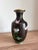 A beautifully detailed vintage Chinese cloisonné enamel vase featuring colorful peonies, delicate butterflies, and...