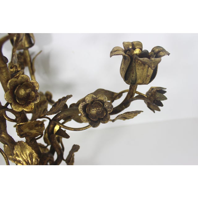Spectacular vintage Italian Baroque or Hollywood Regency style gilded gold metal candelabra with flower and leaf details....