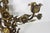Spectacular vintage Italian Baroque or Hollywood Regency style gilded gold metal candelabra with flower and leaf details....