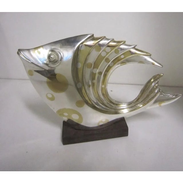 A large and impressive silver and parcel gilt bronze fish attributed to Marie Louise Simard. This elegant fine art...