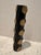 Hand made black and gold round metal vase by Arteriors Home. Vessel can be left empty and displayed as a sculptural...