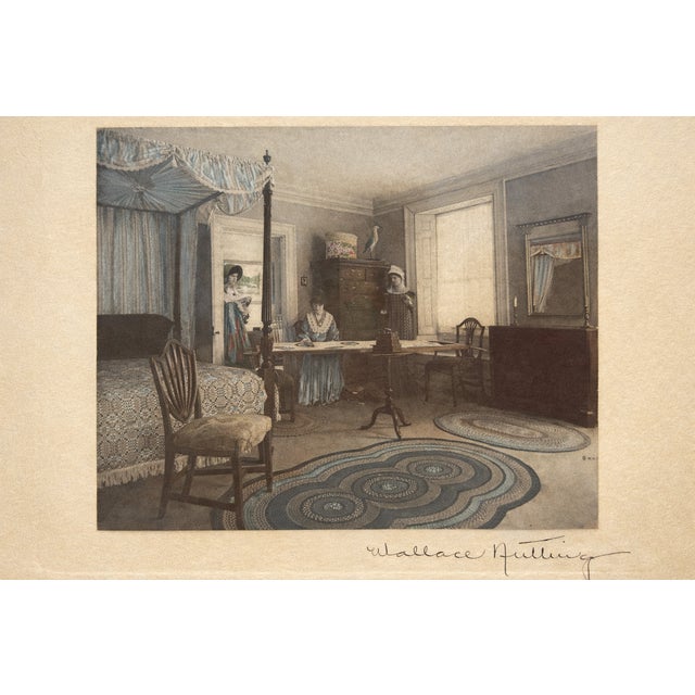 A charming vintage hand-colored photograph by Wallace Nutting, beautifully presented in a warm reddish wood frame with...