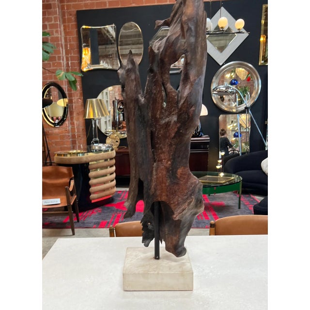 The Vintage Italian Organic Wood Sculpture from the 1980s, displayed on a square marble base, is a captivating art piece...