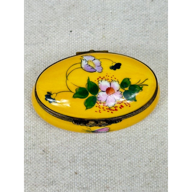 Vintage oval hand painted box by Limoges decorated with flowers. This is a pre-owned item so please see all pictures and...