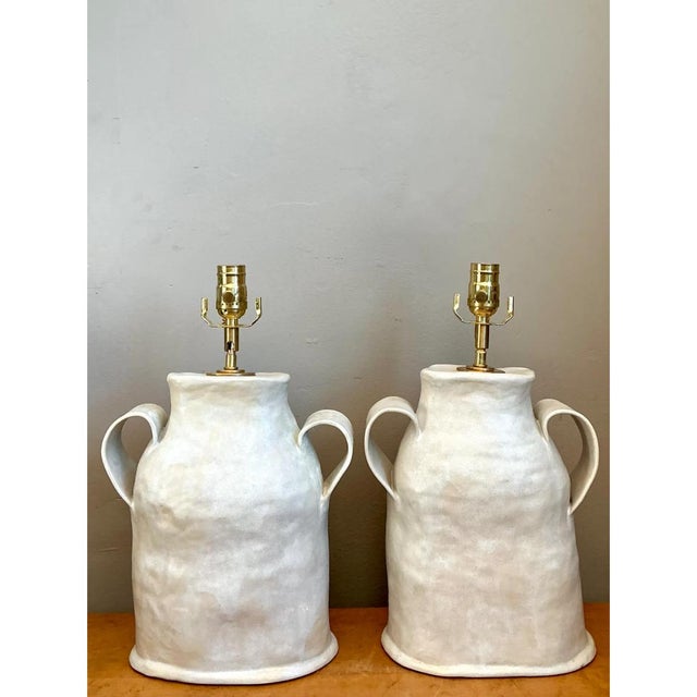 This pair of vintage studio pottery lamps exemplifies biomorphic design, each hand-built in ceramic with an organic,...