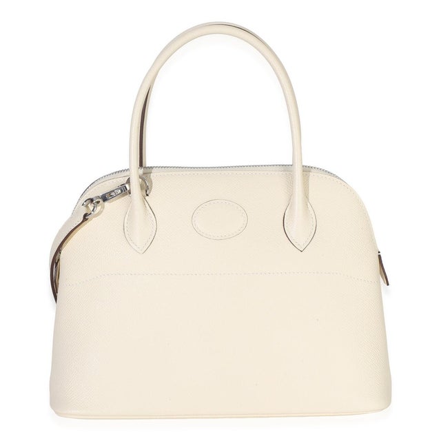 Item #: 154484 Features Interior: One slip pocket Size: 27 Handbag Closure Type: Zip-Around Dimensions: 7.8 x 7 x 4 in...