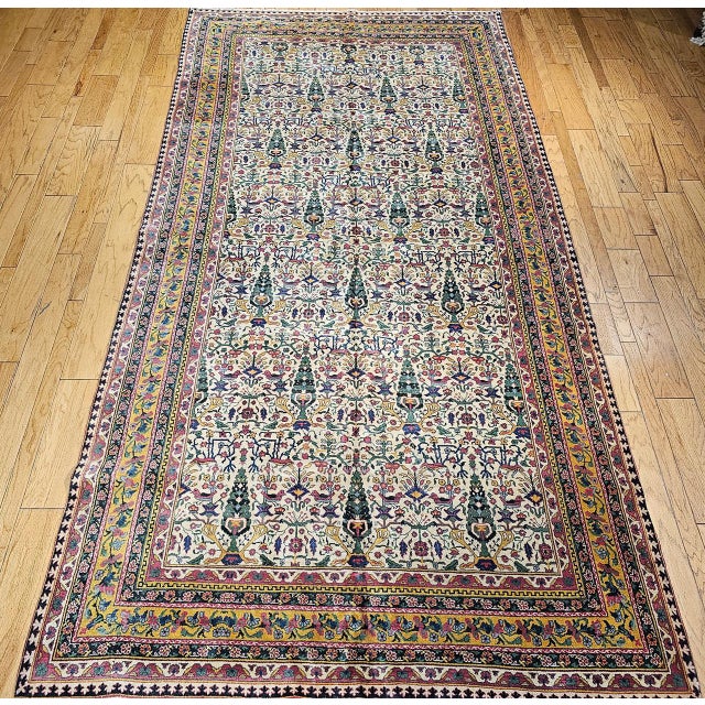 Early 20th-century Indian Agra room size rug featuring an allover “Tree of Life” pattern, inspired by the classical motifs...