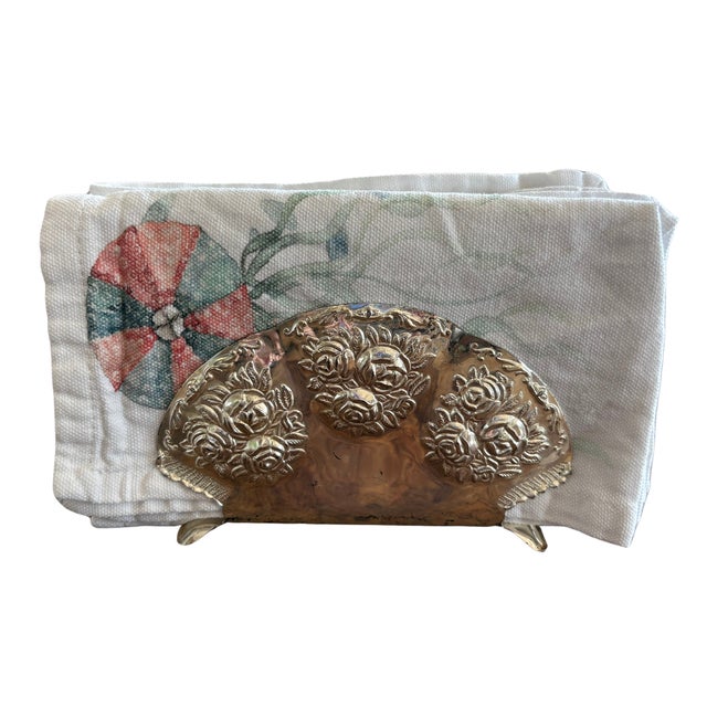 A charming and sculptural silverplated napkin holder by bmf (bayerische metallwarenfabrik), featuring a beautifully...
