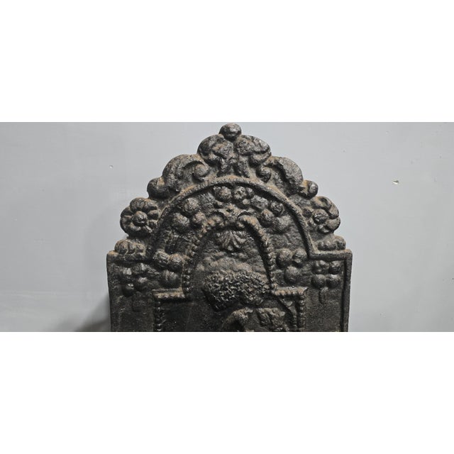 A very nice antique cast iron and brass serpentine fronted grate, back plate with the date 1697, in very good original...