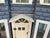 This beautiful antique dollhouse is a masterpiece of Victorian architecture, crafted out of wood with intricate details...