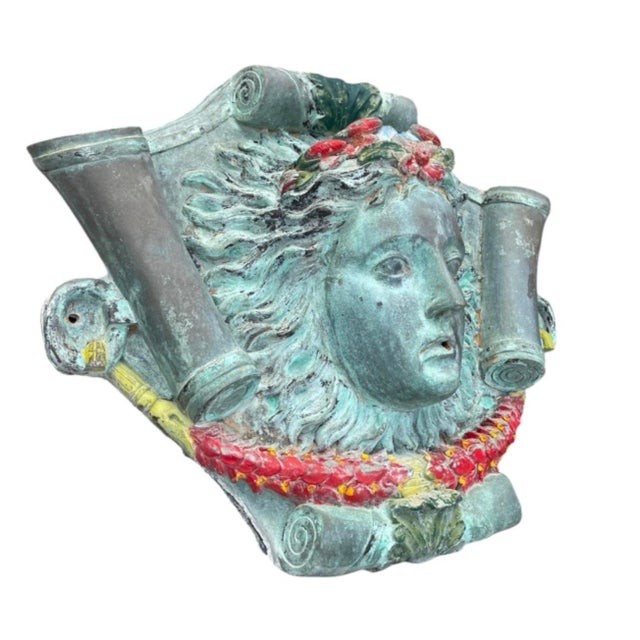 This striking vintage cast wall fountain spout is designed in the classical Neoclassical / Baroque revival style,...