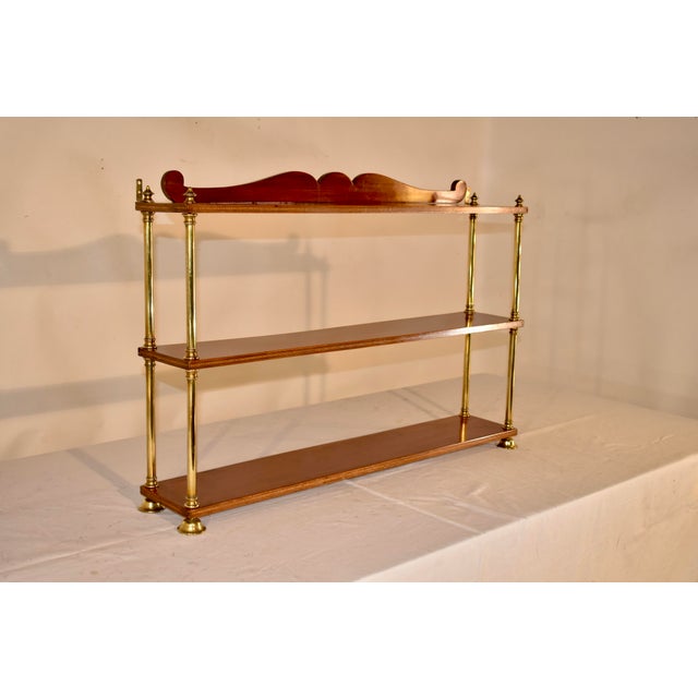 Late 19th century mahogany and brass campaign shelf from England. This is a fabulous shelf which breaks down into flat...