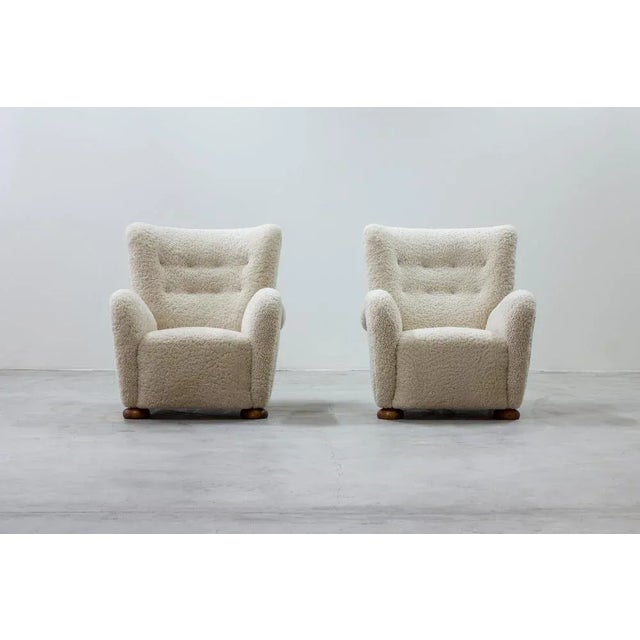 Pair of lounge chairs in the manner of Märta Blomstedt. Designed and produced in Denmark by Danish cabinetmaker. Legs in...