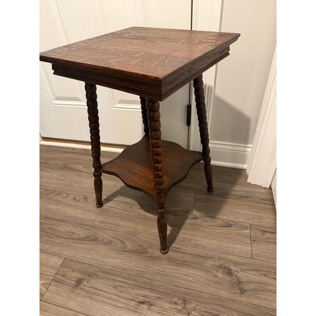 A genuine late-Victorian parlor table in solid quartersawn tiger oak, showing the gorgeous figured ray-fleck grain that...