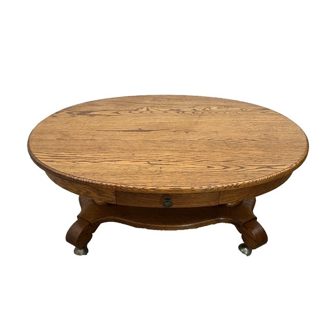 Gorgeous Vintage Oval Coffee Table Tiger Oak, Rolling Caster wheels, Center Drawer, Shelf, Columns, Empire Style, 18" Tall...