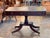A handsome Regency-period English library table crowned with a gilt-tooled leather writing surface in warm, mellowed...