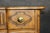 An absolutely gorgeous pair of French Provincial commodes by Baker Furniture Company, dating to the 1980s. Beautifully...
