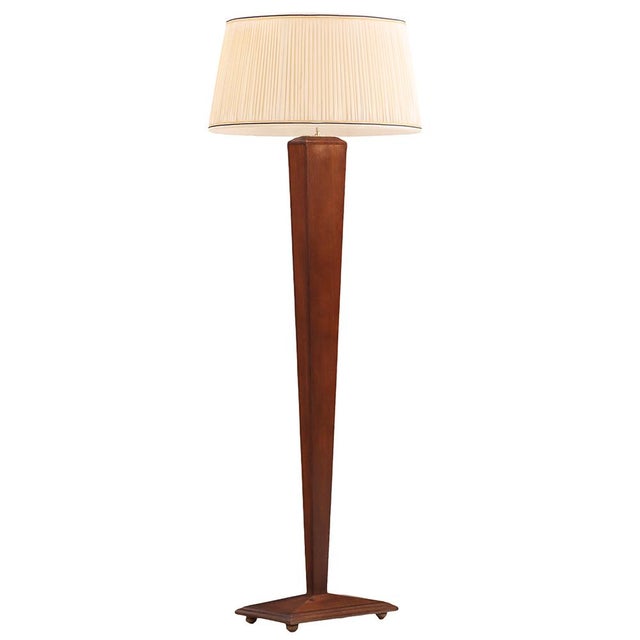 A French oak floor lamp, circa 1940, of angular sculptural form. The design emphasizes geometric lines and architectural...