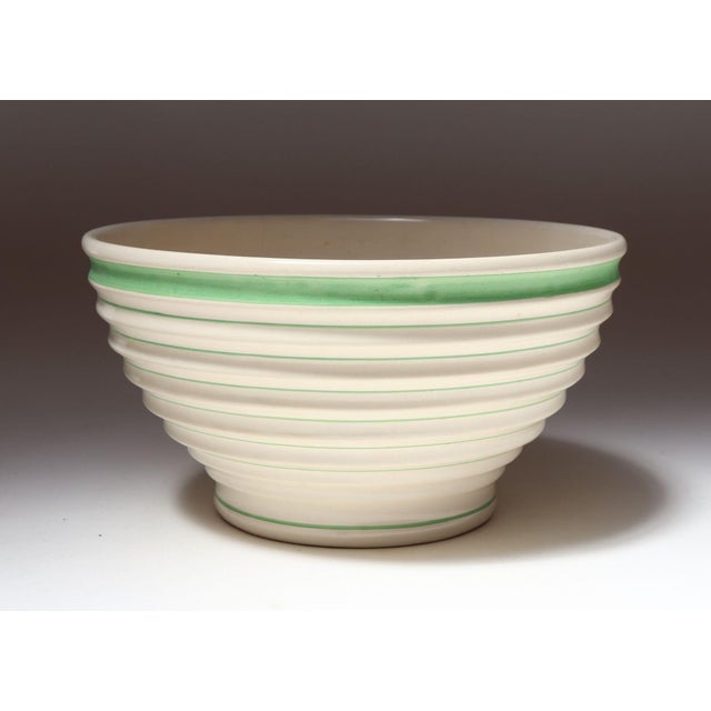 Vintage beehive form yellow ware mixing or salad bowl with attractive green stripe motif (ca. 1940s, USA). Crazing present...