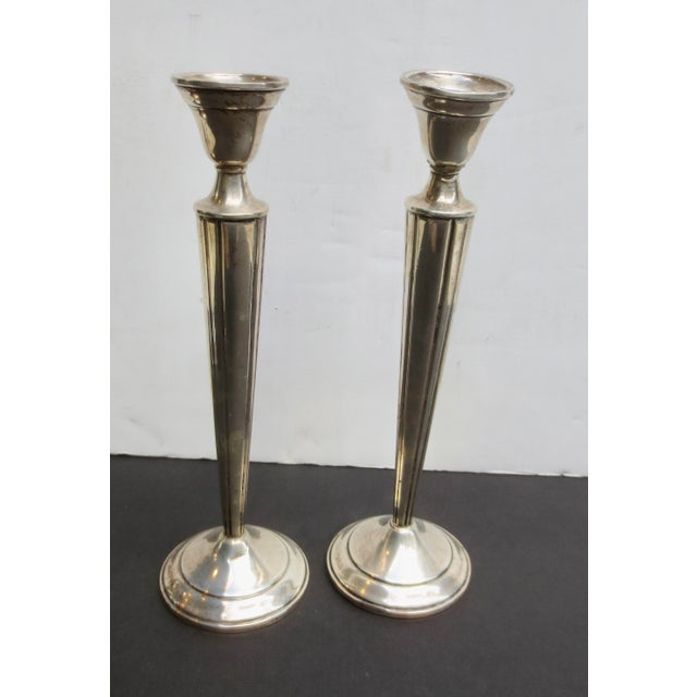 Tall sterling silver and weighted candlesticks by N S Co. The pair measures 9.25" tall and is 2.9" wide at the base. Mid-...