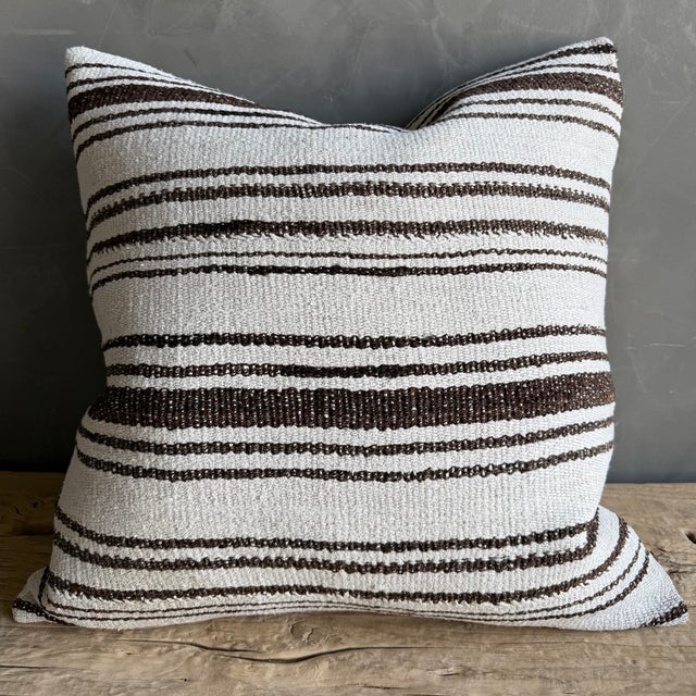 Creamy white hemp rug pillow with stripes. Soft hand, linen blend backing with zipper closure. Spot cleaning is...