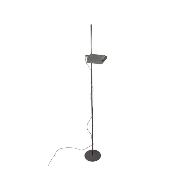 A 1980s Italian black adjustable floor lamp produced by Gammalux. A rectangular light is connected to a central pole,...