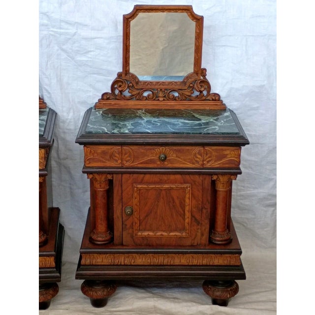 An elegant matched pair of Italian nightstands dating to the 1930s, blending Art Deco sophistication with Neoclassical...