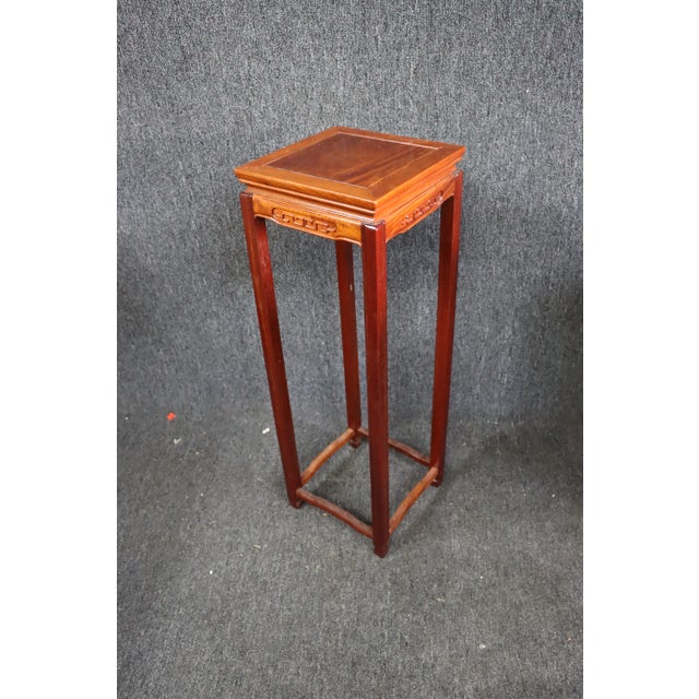Chinese pedestal plant stand , made of rosewood, square with 4 legs , carved Asian designs on skirt