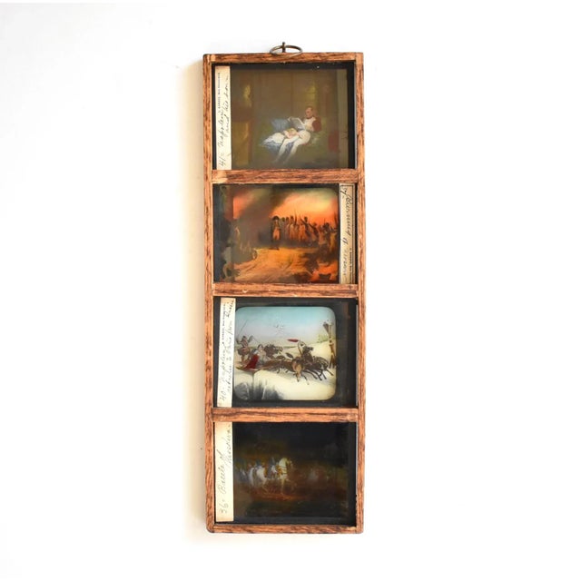 A framed set of 4 antique magic lantern slides featuring scenes from the life of Napoleon Bonaparte. Antique colored...