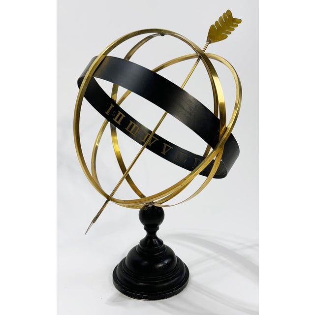 Vintage large 19.5"H armillary framed in brass with roman numerals imprinted inside metal strips to indicate time, all on...