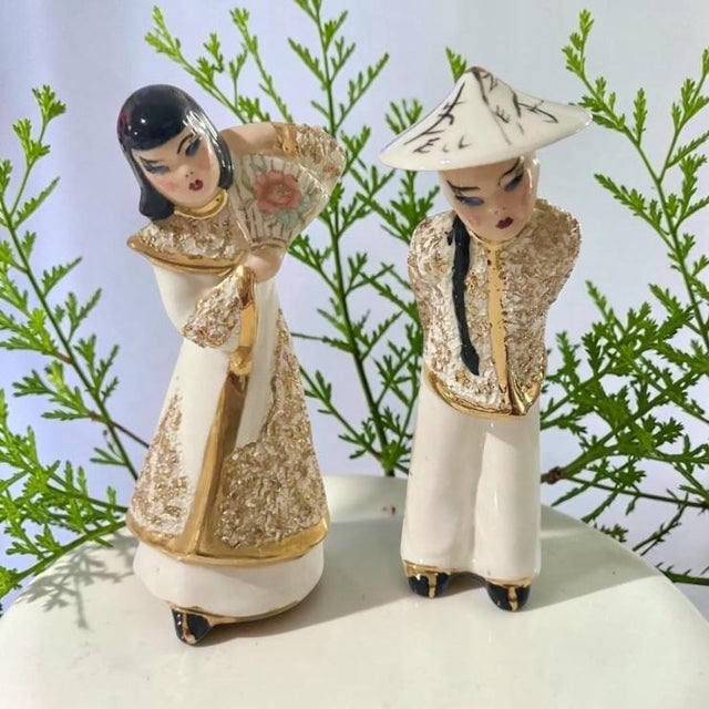 Beautifully sculpted from fine porcelain, these statues highlight the classic "California Pottery" design aesthetics of...