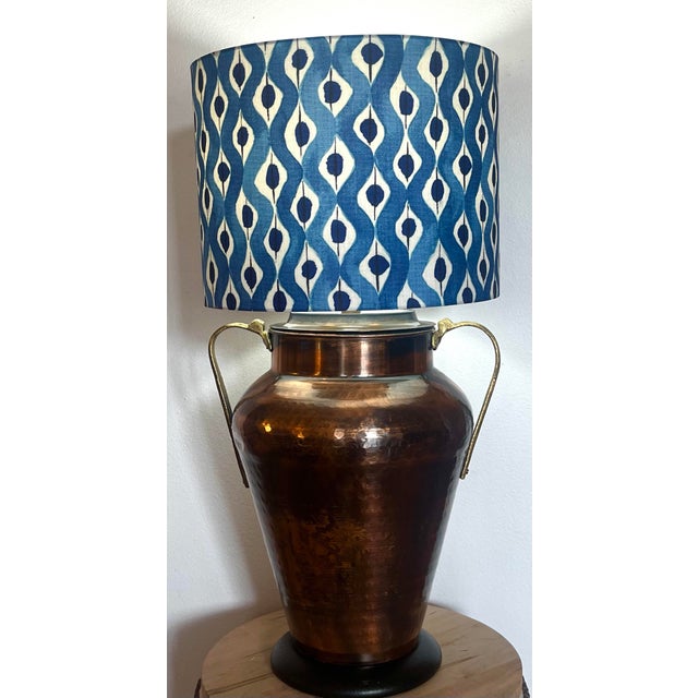 This large copper table lamp with brass handles by iconic lamp designer Frederick Cooper demands attention. The hammered...