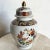 This beautiful vintage Asian porcelain ginger jar features intricate hand-painted floral motifs in vibrant hues of orange,...